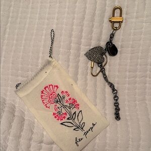 Free People mixed metal bag charm.